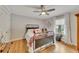 Cozy bedroom with hardwood floors, natural light, a ceiling fan, and neutral colors creates a relaxing ambiance at 236 Ridge Nw Ave, Marietta, GA 30064