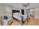 Bedroom with a wooden bed frame, light hardwood floors, ceiling fan and bathroom access at 236 Ridge Nw Ave, Marietta, GA 30064