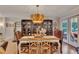 Elegant dining room featuring hardwood floors, stylish chandelier, and glass-door cabinets at 236 Ridge Nw Ave, Marietta, GA 30064