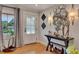 Chic entryway featuring hardwood floors, decorative mirrors, and elegant lighting fixtures at 236 Ridge Nw Ave, Marietta, GA 30064