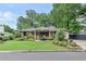 Charming brick home with a well-manicured lawn and lush landscaping adding curb appeal at 236 Ridge Nw Ave, Marietta, GA 30064