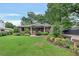 Charming brick home with a well-manicured lawn and lush landscaping adding curb appeal at 236 Ridge Nw Ave, Marietta, GA 30064