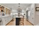 Bright kitchen featuring white cabinets, granite counters, stainless appliances, and a center island with seating at 236 Ridge Nw Ave, Marietta, GA 30064