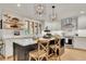 Kitchen island with white countertop, seating, and modern pendant lighting at 236 Ridge Nw Ave, Marietta, GA 30064