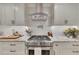 Modern kitchen with stainless steel range, custom tile backsplash, and granite countertops at 236 Ridge Nw Ave, Marietta, GA 30064