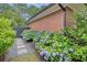 Charming landscaping with colorful hydrangeas, stone pathway, and lush greenery enhancing curb appeal at 236 Ridge Nw Ave, Marietta, GA 30064