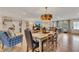 Open-concept living and dining room with modern chandelier and hardwood flooring at 236 Ridge Nw Ave, Marietta, GA 30064