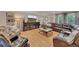 Spacious living room with hardwood floors, a leather sectional sofa, and elegant furnishings at 236 Ridge Nw Ave, Marietta, GA 30064