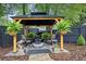 Relaxing backyard gazebo with fire pit, stylish seating and black privacy fence at 236 Ridge Nw Ave, Marietta, GA 30064