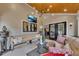 Inviting sunroom featuring a modern lighting fixture, TV, and cozy seating perfect for entertaining guests at 236 Ridge Nw Ave, Marietta, GA 30064