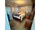 Bedroom with a full-size bed, neutral carpet and walls, and a beachy themed wall print at 25 Jessamine Trail Trl, Lawrenceville, GA 30046