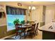 Bright breakfast nook with a cozy dining table and a view to the back yard at 25 Jessamine Trail Trl, Lawrenceville, GA 30046