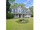 Beautiful two-story home featuring a landscaped front yard and inviting porch at 25 Jessamine Trail Trl, Lawrenceville, GA 30046