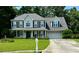 Charming two-story home with a well-manicured lawn and a welcoming front porch at 25 Jessamine Trail Trl, Lawrenceville, GA 30046