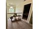 Upstairs landing with decorative furniture and partially visible bedroom at 25 Jessamine Trail Trl, Lawrenceville, GA 30046