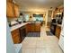 Functional kitchen with wooden cabinets, providing ample space for cooking and storage at 25 Jessamine Trail Trl, Lawrenceville, GA 30046