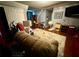 Relaxing living room with a comfortable recliner, area rug, and mounted flat screen TV at 25 Jessamine Trail Trl, Lawrenceville, GA 30046