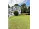 Expansive backyard with lush green lawn, offering plenty of space for outdoor activities at 25 Jessamine Trail Trl, Lawrenceville, GA 30046