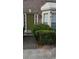 Charming home entrance with an olive colored front door and well maintained landscaping at 2735 Parkway Trl, Lithonia, GA 30058