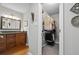 Bathroom boasts a granite vanity and walk-in closet for storage and convenience at 3408 Lake Pointe Cir, Roswell, GA 30075