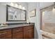 Bathroom features granite vanity, framed mirror, and tiled shower for a luxurious feel at 3408 Lake Pointe Cir, Roswell, GA 30075