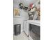 Well-equipped laundry room with modern washer and dryer, ample storage, and practical design at 3408 Lake Pointe Cir, Roswell, GA 30075