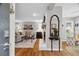 Open-concept living room with a fireplace and hardwood floors at 3408 Lake Pointe Cir, Roswell, GA 30075