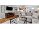 Stylish living room flowing into the kitchen and dining areas at 3408 Lake Pointe Cir, Roswell, GA 30075