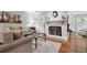 Inviting living room featuring a cozy fireplace and neutral decor at 3408 Lake Pointe Cir, Roswell, GA 30075