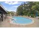 Inviting community pool surrounded by lounge chairs and lush greenery at 3408 Lake Pointe Cir, Roswell, GA 30075