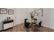 Dining area with modern table, hardwood floors, and contemporary decor at 3181 Pennington Sw Cir, Atlanta, GA 30354