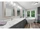 Luxurious bathroom with double vanity, soaking tub, separate shower, and natural light at 1005 Wellers Ct, Roswell, GA 30076