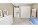 Comfortable bedroom with closet, and access to upstairs hallway at 1005 Wellers Ct, Roswell, GA 30076