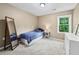 Cozy bedroom with a mirror and natural light at 1005 Wellers Ct, Roswell, GA 30076