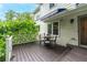 Wooden back deck with a table and chairs under an awning at 1005 Wellers Ct, Roswell, GA 30076