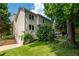 Well-maintained home with a manicured lawn and mature trees at 1005 Wellers Ct, Roswell, GA 30076