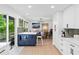 Bright, remodeled kitchen with white cabinets, blue island and modern appliances at 1005 Wellers Ct, Roswell, GA 30076