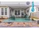 Outdoor patio with rocking chairs and swing at 1115 Hunters Creek Ct, Lawrenceville, GA 30043