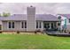 Well-maintained backyard featuring a spacious lawn, patio area, and mature landscaping at 1115 Hunters Creek Ct, Lawrenceville, GA 30043