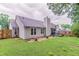 A lush, green backyard with a well-kept lawn and fenced perimeter provides privacy and space at 1115 Hunters Creek Ct, Lawrenceville, GA 30043