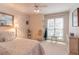 Bright bedroom with neutral carpet, chair, and view of the yard at 1115 Hunters Creek Ct, Lawrenceville, GA 30043