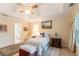 Comfortable bedroom with vaulted ceiling, ample natural light, and hardwood flooring at 1115 Hunters Creek Ct, Lawrenceville, GA 30043