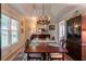 Formal dining room with elegant chandelier, rug, and display cabinet at 1115 Hunters Creek Ct, Lawrenceville, GA 30043