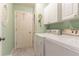 Functional laundry room featuring a washer, dryer, and storage cabinets at 1115 Hunters Creek Ct, Lawrenceville, GA 30043