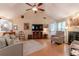 Inviting living room featuring a vaulted ceiling, fireplace, and wood floors at 1115 Hunters Creek Ct, Lawrenceville, GA 30043