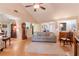 Open living room with hardwood floors, fireplace and adjoined dining area at 1115 Hunters Creek Ct, Lawrenceville, GA 30043