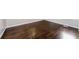 The empty bedroom boasts refinished hardwood floors and neutral paint at 1381 Benteen Way Southeast, Atlanta, GA 30315