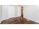 Bedroom with hardwood floors, closet doors, and fresh paint at 1381 Benteen Way Southeast, Atlanta, GA 30315