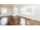 Bright living room featuring hardwood floors and big windows for natural light and views at 1381 Benteen Way Southeast, Atlanta, GA 30315