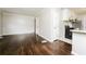 View of open living space with hardwood floors, leading to the kitchen and multiple rooms at 1381 Benteen Way Southeast, Atlanta, GA 30315